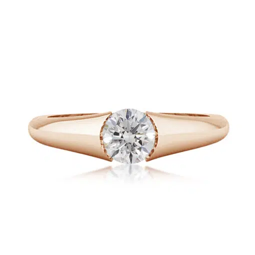 A modern style diamond ring with a diamond tension set in the centre, the ring also has under rail for extra strength.