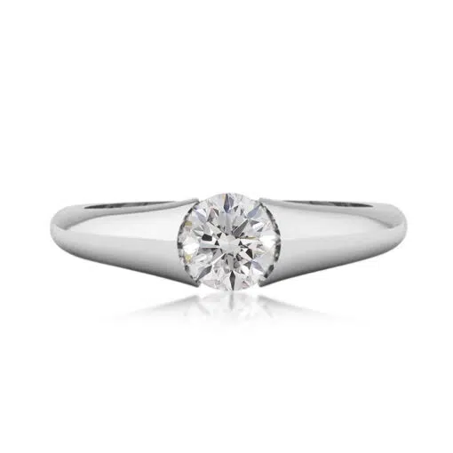 A modern style diamond ring with a diamond tension set in the centre, the ring also has under rail for extra strength.