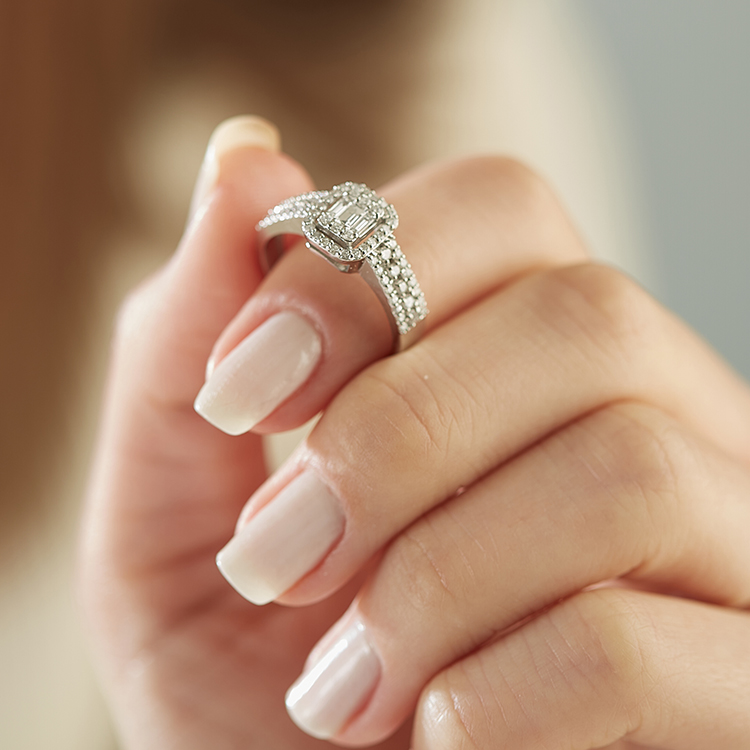 vintage inspired diamond engagement ring on hand